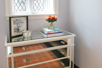 Mid-sized eclectic travertine floor entryway photo in Miami with gray walls