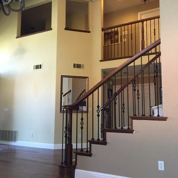 San Ramon Curved Stair Update with Tread Ends and Iron Balusters