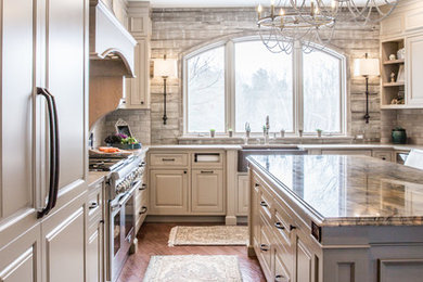 Huge farmhouse medium tone wood floor and brown floor kitchen pantry photo in Cleveland with a farmhouse sink, raised-panel cabinets, beige cabinets, quartzite countertops, beige backsplash, marble backsplash, stainless steel appliances and an island