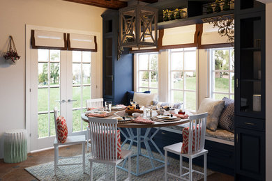 Small eclectic medium tone wood floor and brown floor enclosed dining room photo in Denver with white walls