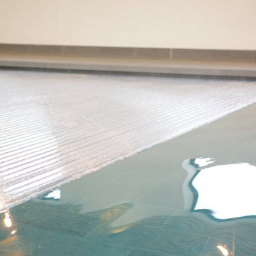 Automatic swimming pool cover