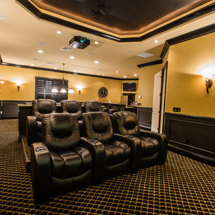 Design ideas for a medium sized classic enclosed home cinema in Orlando with beige walls, carpet, a projector screen and multi-coloured floors.