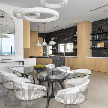 Malibu Contemporary Kitchen with Waterfall Island and Full Marble Backsplash