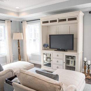 Inspiration for a traditional home cinema in New York with grey walls, dark hardwood flooring and brown floors.