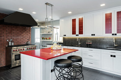 Example of a large trendy single-wall ceramic tile eat-in kitchen design in New York with a drop-in sink, shaker cabinets, white cabinets, granite countertops, black backsplash, ceramic backsplash, stainless steel appliances and an island