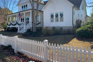 Inspiration for a mid-sized timeless white two-story concrete exterior home remodel in Atlanta with a shingle roof and a gray roof
