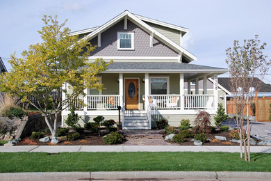Inspiration for a craftsman green two-story gable roof remodel in Seattle