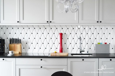 Example of a small eclectic l-shaped light wood floor open concept kitchen design in Other with a drop-in sink, wood countertops, white backsplash, ceramic backsplash and no island