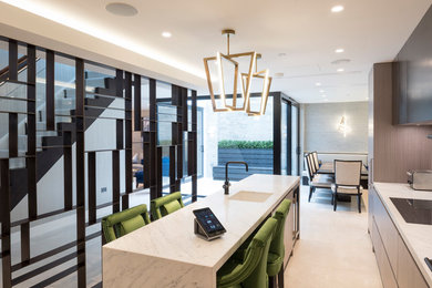 Photo of a small contemporary single-wall kitchen in London with an island.