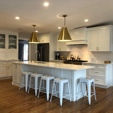 Belmont, MA White Dura Supreme kitchen with statement gold pendants