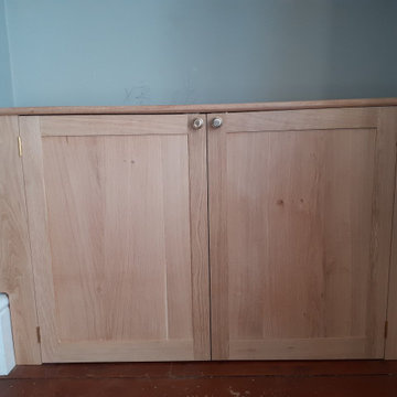 Oak alcove cabinet and shelves in Victorian property