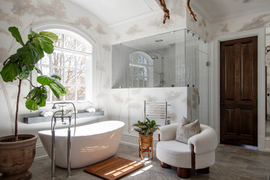 Huge transitional master white tile and ceramic tile porcelain tile, multicolored floor, double-sink, vaulted ceiling and wallpaper bathroom photo in Nashville with beaded inset cabinets, dark wood cabinets, a one-piece toilet, white walls, an undermount sink, soapstone countertops, a hinged shower door, black countertops and a floating vanity