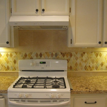 Juparana Granite counter-top with a rhomboid onyx back-splash
