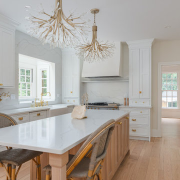 Château Charm: French-Inspired Kitchen Renovation with Plaster Hood Blue Stove a