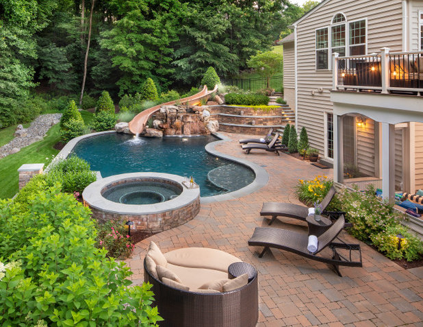 Traditional Pool by Kane Landscapes Inc