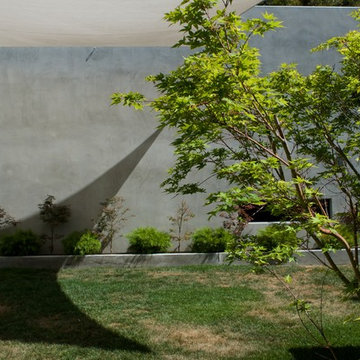Modern Landscape Design with Shade Sail shadow