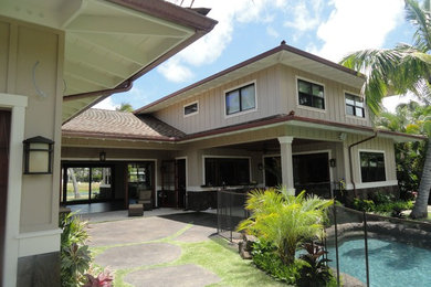 Mid-sized traditional beige two-story mixed siding gable roof idea in Hawaii