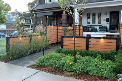 Inspiration for a mid-sized contemporary partial sun front yard concrete paver walkway in Toronto for summer.