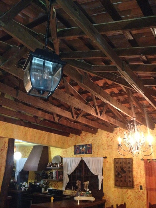 Brighten dark exposed rafter ceiling