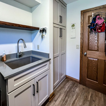 Laundry Room with Custom Cabinetry Quartz Countertop and Custom Floating Shelf