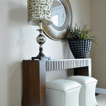 living area console table and ottomans