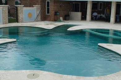 Example of an arts and crafts backyard custom-shaped pool design in Orlando