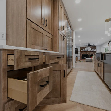 Warm Cherry Kitchen and Powder Room Remodel with Waterfall Island in Herndon, VA