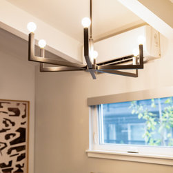 Striking Art and Refined Decor in a Modern Elegant Office - Chandeliers