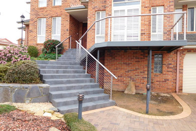 Photo of a mid-sized modern deck in Canberra - Queanbeyan.
