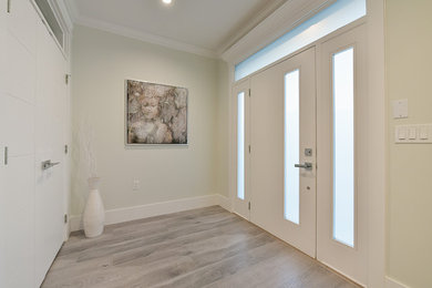 Design ideas for a transitional entryway in Vancouver.