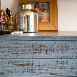 Metaphor | Close-up of chest of drawers in distressed wood finish - Dressers
