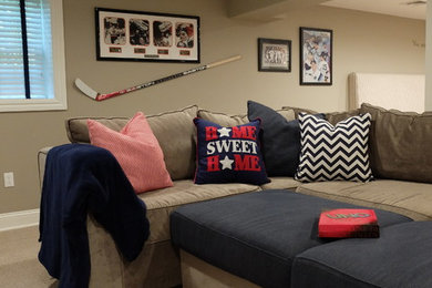 Example of a large transitional underground laminate floor and gray floor basement design in Other with beige walls