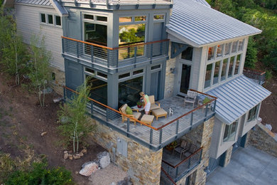 Large minimalist beige three-story mixed siding gable roof photo in Salt Lake City