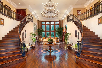 Example of a classic dark wood floor foyer design in Portland with beige walls