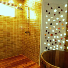 tub inside shower below wood deck