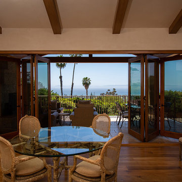 Folding Door Systems Create Open-Air Dining in a Spanish Style Home