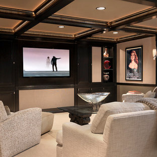 Classic enclosed home cinema in St Louis with beige walls, carpet, a wall mounted tv and beige floors.