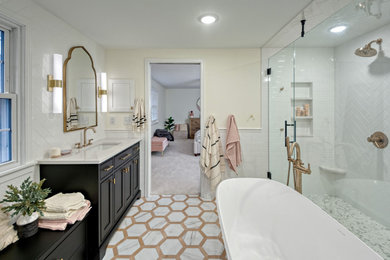 Inspiration for a mid-sized timeless master white tile and ceramic tile porcelain tile, multicolored floor and double-sink bathroom remodel in Minneapolis with beaded inset cabinets, black cabinets, a two-piece toilet, white walls, an undermount sink, quartz countertops, a hinged shower door, white countertops, a niche and a built-in vanity