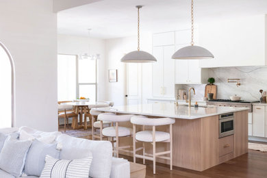 Inspiration for a transitional kitchen remodel in Austin with quartz countertops, quartz backsplash and white countertops