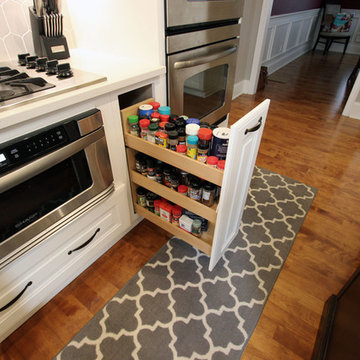 White Kitchen with Espresso Island and Eternia Caringdale Quartz Countertop