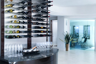 Trendy single-wall white floor bar cart photo in San Diego with flat-panel cabinets, black cabinets, gray backsplash, metal backsplash and gray countertops