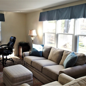 Box pleat valances enhanced with covered buttons in a quiet study