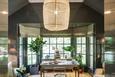 Large elegant freestanding desk light wood floor study room photo in New York with gray walls
