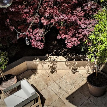 Split Level Travertine Patio and Ipe Deck with Cable Railing
