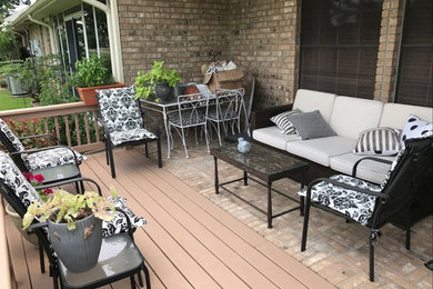 Inspiration for a mid-sized timeless backyard patio remodel in Houston with decking and a roof extension