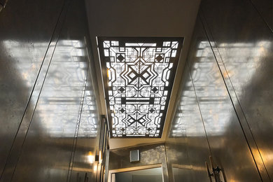 Hallway transformation with art deco fretwork ceiling light panel
