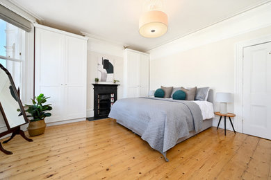 Medium sized contemporary bedroom in Sussex.