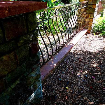 Stone Pillars with Ornate Steel Fencing