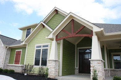 Large craftsman green two-story mixed siding exterior home idea in Indianapolis