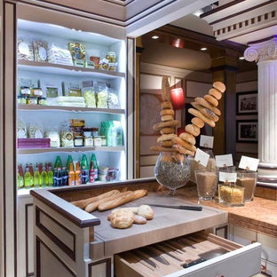 Large traditional kitchen pantry pictures - Large elegant dark wood floor kitchen pantry photo in Milan with an island